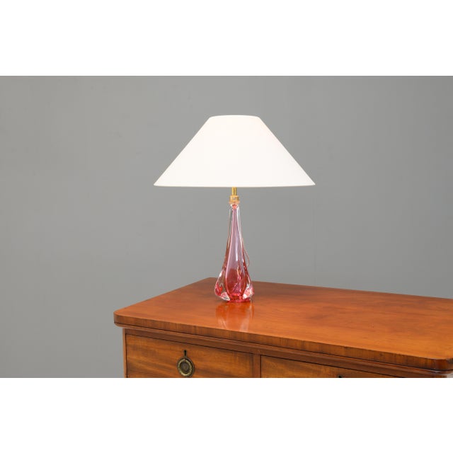 Vintage crystal table lamp in a pale pink colour. Re-wired and tested. France circa 1960. Shade not included. This piece...