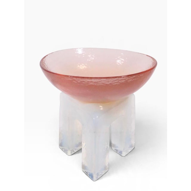 Cool post modern style art glass compote, by Hudson Beach, circa 1980's. The bowl is in pink glass, the tri pod is...