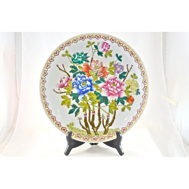 Large 14 inch vintage hand-decorated glazed spring floral Chinese charger in vivid tones of pink, blue, green, and orange....