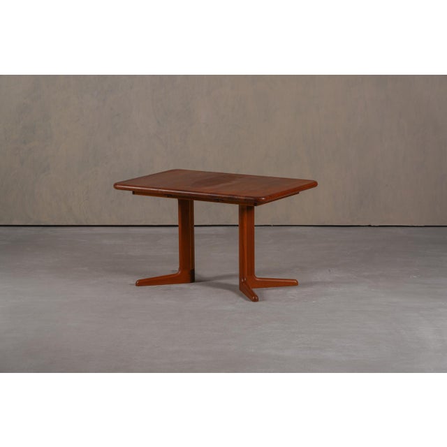 This vintage Morten dining table was designed by Niels Koefoed and produced by Hornslet Mobelfabrik in Denmark during the...