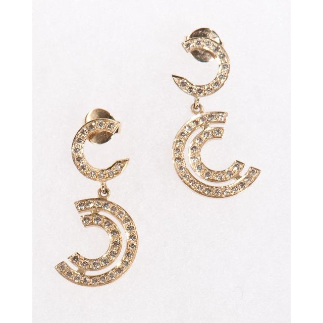 These beautiful earrings are made exclusively by hand by Artisans and designed by Carla Miller Each earring contains...