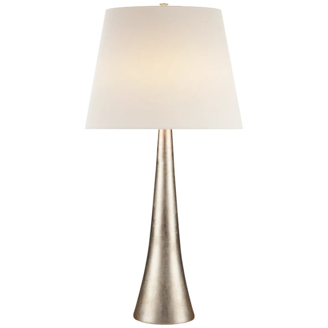 Dover Table Lamp in Burnished Silver Leaf with Linen Shade Designer: AERIN Height: 34.75" Shade Detail: 13" x 18" x 13"...