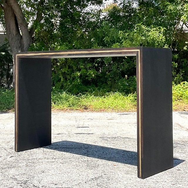 Make a bold statement with this vintage contemporary monumental custom brass inlay console table. Crafted with American...