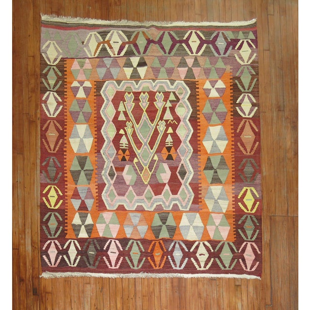 Mid-20th Century Turkish square size Kilim. Measures: 6'8” x 7' With the Jijim weaving technique, different colored...