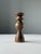 Sculptural turned wooden candlestick produced in Hungary during the mid-20th century. The piece features an elegant...