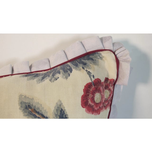 A pillow made from a circa 1920’s English Printed Linen, backed and edged with hand dyed linen Damask. A down insert is...