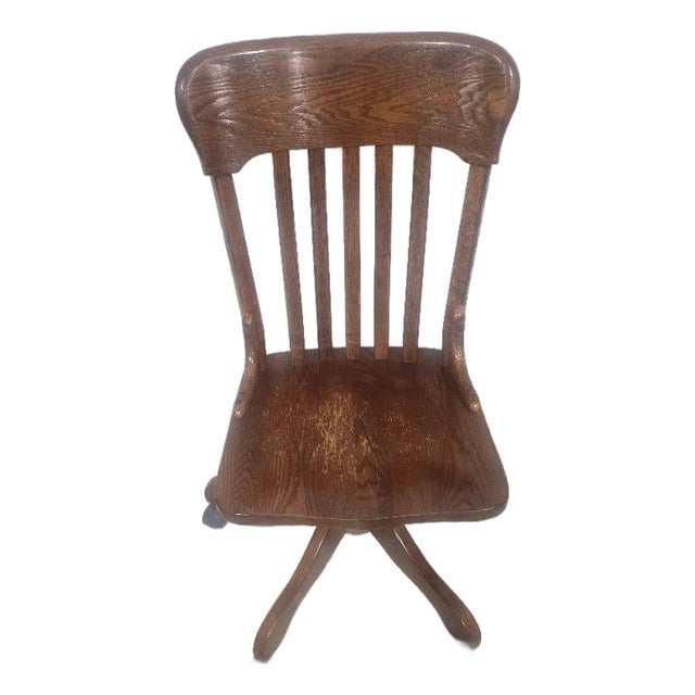 Vintage Solid Oak Swivel Banker's Chair With Casters For Sale