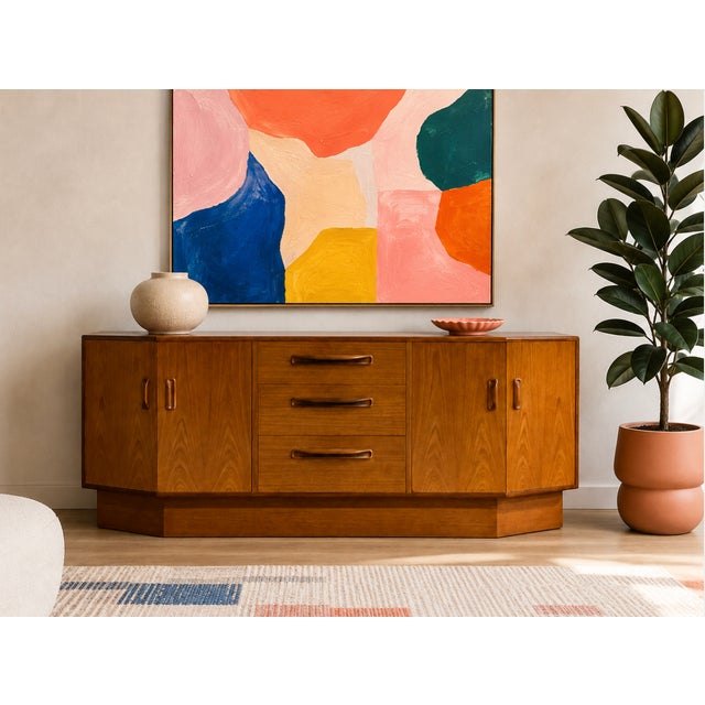 Mid Century Modern Teak Credenza by G-Plan, Made in England, c. 1960’s. Featuring gorgeous teak wood grains, beautifully...