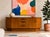 Mid Century Modern Teak Credenza by G-Plan, Made in England, c. 1960’s. Featuring gorgeous teak wood grains, beautifully...
