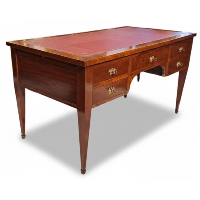 Refined French desk in mahogany and crotchet mahogany, featuring the sober, geometric lines typical of the late 18th and...