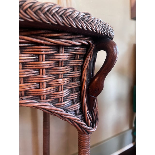 Darling vintage wicker side table with beautiful wood carving of three wood carved duck heads. Measures 17” wide 30.5” tall