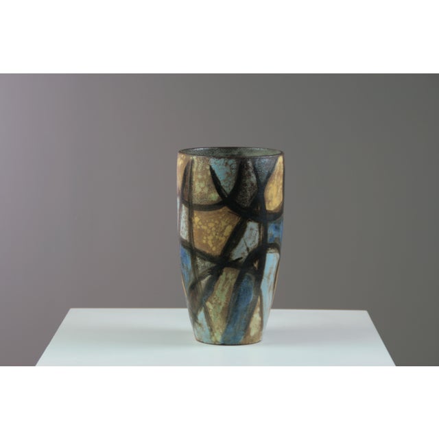 Large Kostanda ceramic vase with abstract geometric decoration, characteristic of post-war modernist design. Dynamic...