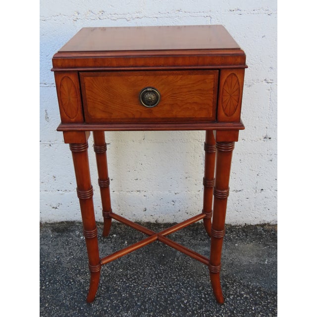 This beautiful Nightstand is made of wood, solid wood, and veneer. It was made by Ethan Allen and it is labeled. This...