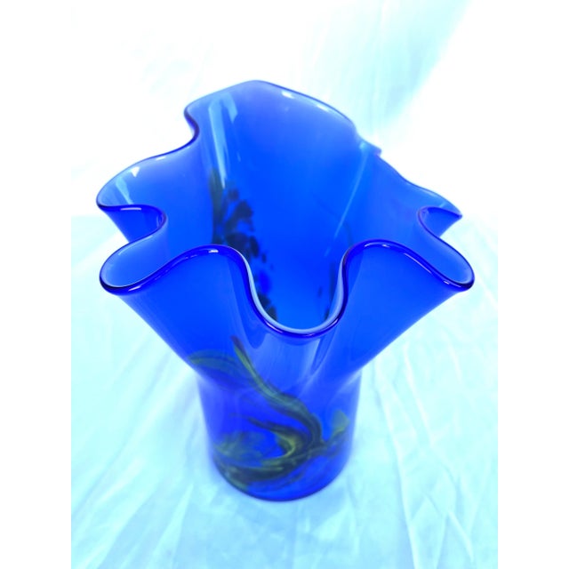 Beautiful vintage Murano style vase with ruffled top in blue and some other colors. This very unique look will bring color...