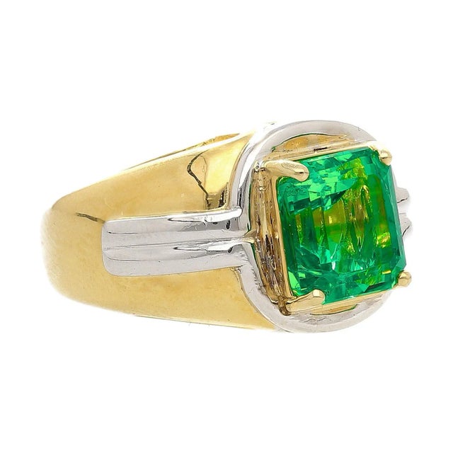 AGL Certified investment grade Emerald mens ring. The center stone is a 3.98 carat Colombian Emerald with minor oil. Set...