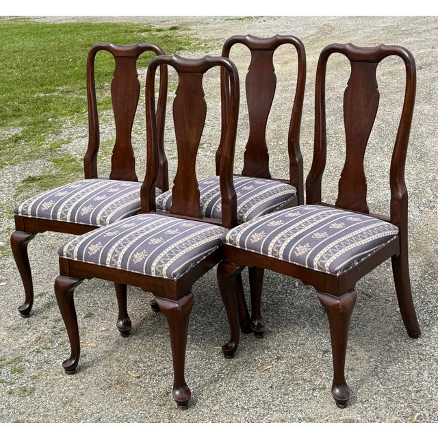 Beautiful set of dining chairs by Ethan Allen. Features a timeless Queen Anne style, splat back, cabriole legs and...