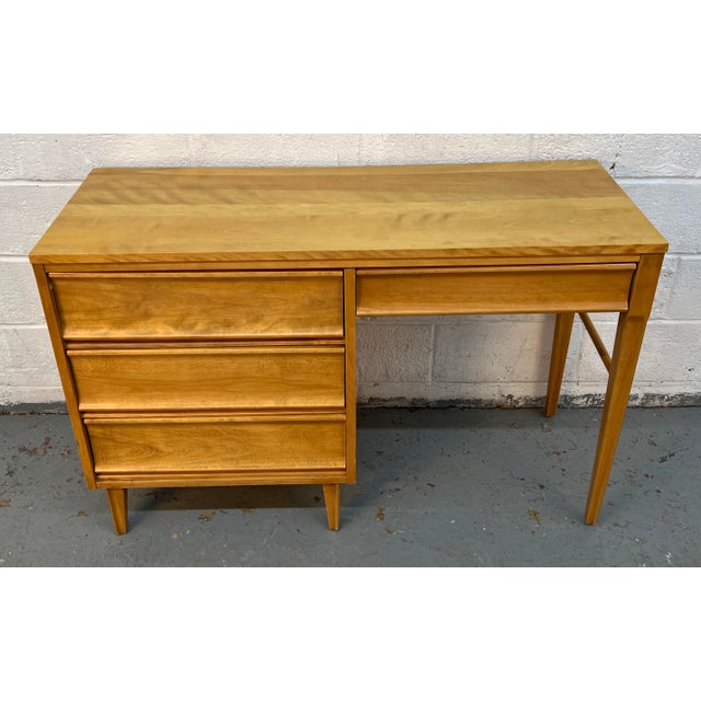 Add timeless functionality and classic design to your workspace with this mid-century modern writing desk by Morris of...