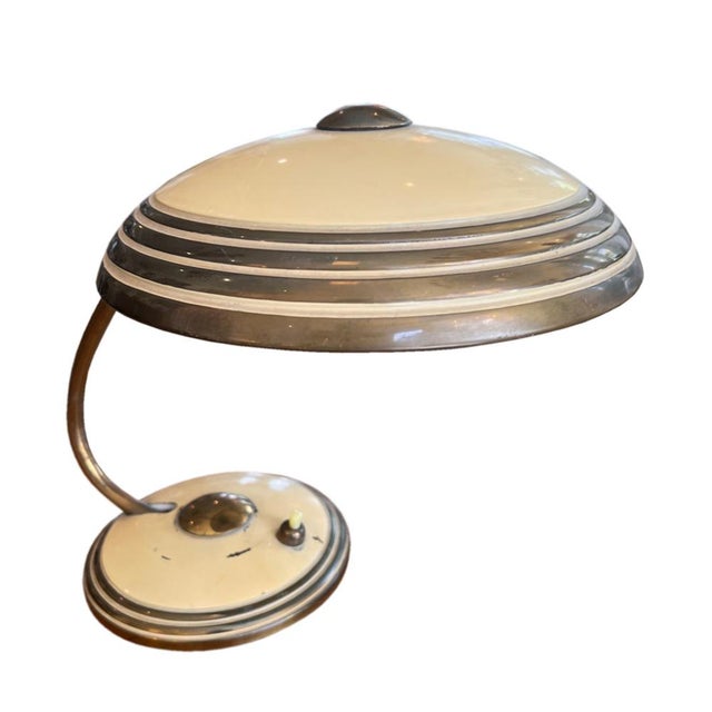 A lovely little desk lamp made by helo leuchten in the 1950s, with a space-age design and a good colour. it retains the...