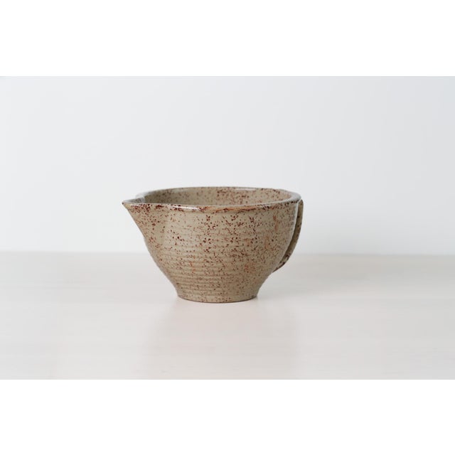 Antique ca. late 1920s Monmouth Western Stoneware Pottery batter bowl with a generous pour spout and loop handle featuring...