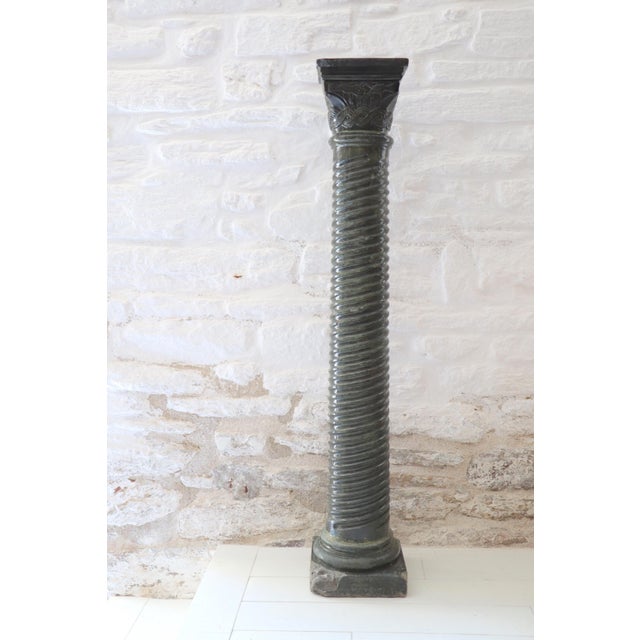 Large twisted column made of reconstituted and natural stone, 20th century. Composed of an elegant twisted shaft,...