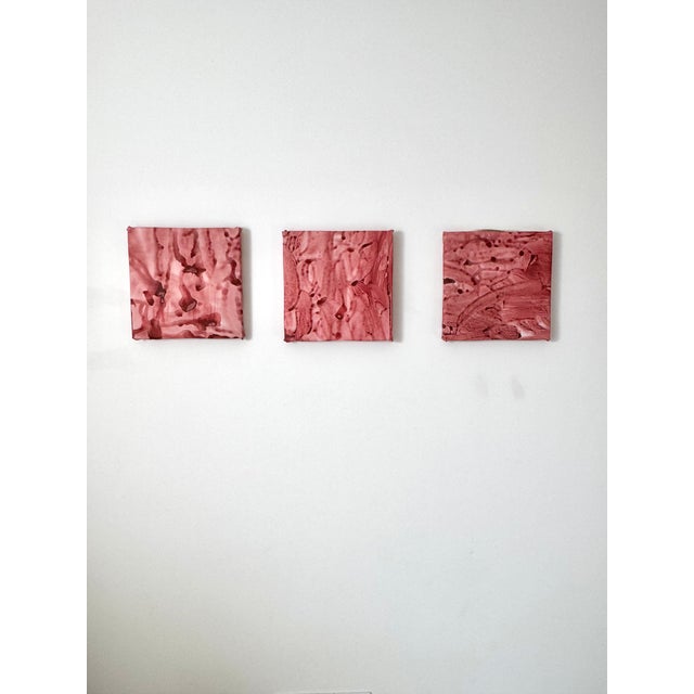 This abstract acrylic painting on canvas features a soft pink and muted rose color palette with visible brush strokes and...