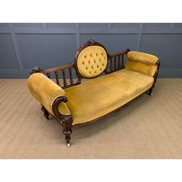 A very good mid Victorian period upholstered settee. Well constructed in solid walnut and embellished with carved...