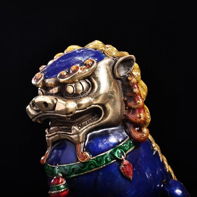This is a fierce and highly decorative matching pair of vintage Chinese cloisonné foo dogs (guardian lions), traditionally...