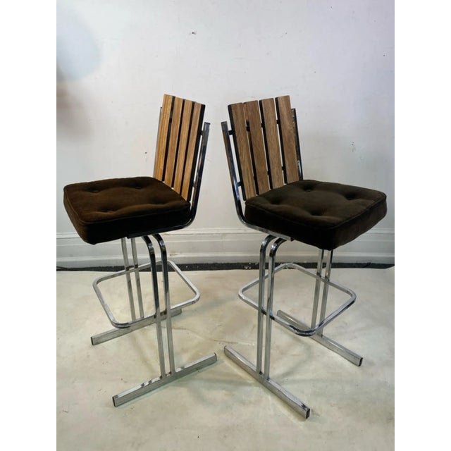 Modern Pair Of Chrome Slatted And Wood Laminate Swivel Bar Stools Upholstered With Chocolate Mohair Button Tufted Seats....