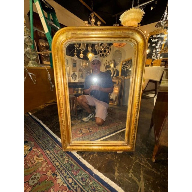 This product is a fine 19th-century French Louis Philippe mirror with a Greek key frame, adding a touch of elegance and...