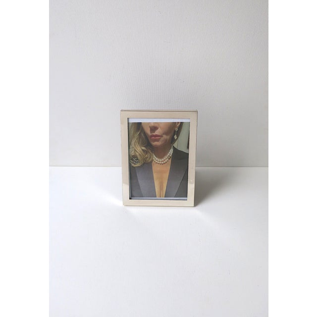 A beautiful, French handmade sterling silver rectangular picture frame from luxury Maison, Cartier, in the Modern design...