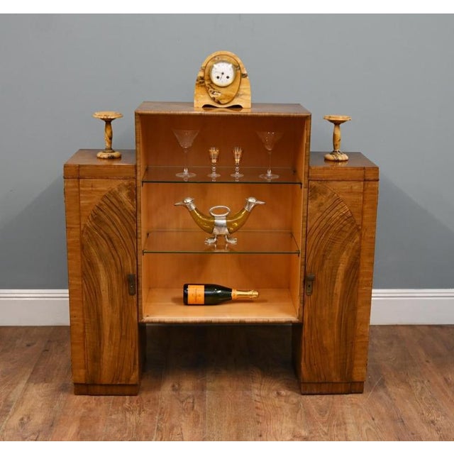 Striking Art Deco display cabinet in richly figured walnut Strong architectural stepped form with distinctive fan-pattern...