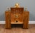 Striking Art Deco display cabinet in richly figured walnut Strong architectural stepped form with distinctive fan-pattern...
