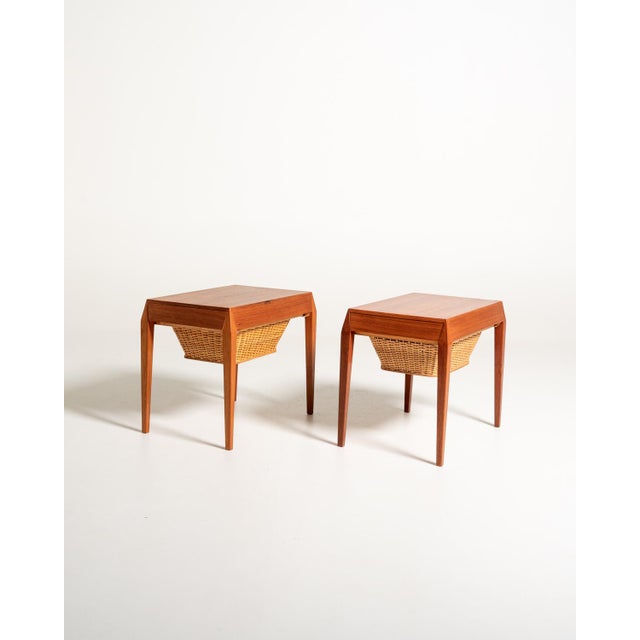 Pair of teak bedside tables with internally divided drawer and suspended woven rattan basket. Model 35 by Severin Hansen...