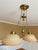 This classic dual-light pendant chandelier features an elegant, traditional design crafted from solid brass with a...