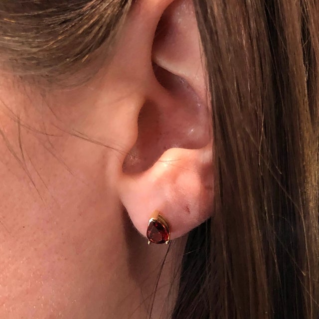 Their pear-shape design makes these studs a super fun and unique addition to your look! These deep Garnet gemstones are...