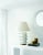 Linden Table Lamp in Plaster White with Linen Shade Designer: Kelly Wearstler Height: 34.25" Shade Detail: 12" x 23" x...