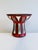 Signed vessel – usable as a vase or candlestick – designed by Heidi Kippenberg with a powerful combination of white and...