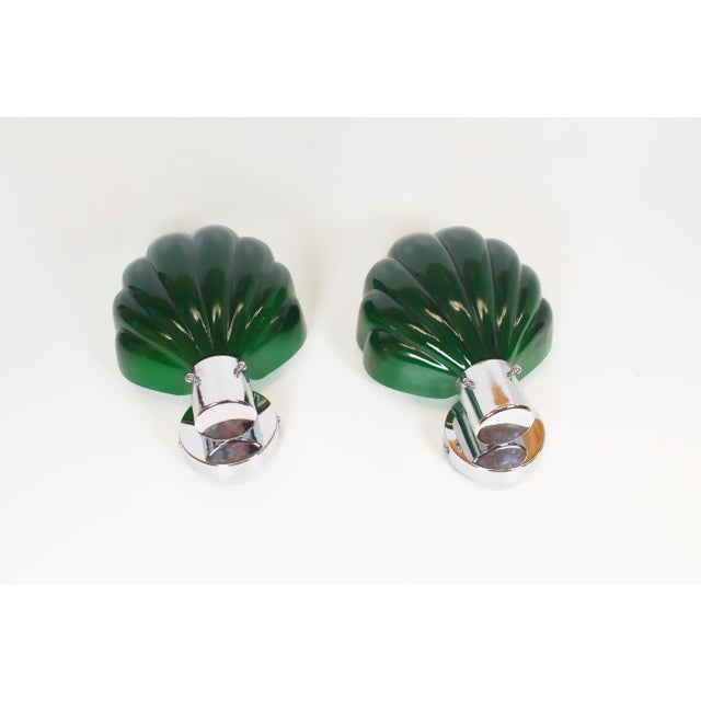 Beautiful and uncommon set of Italian wall lamps in the shape of shells. Both in very good, almost new condition with...