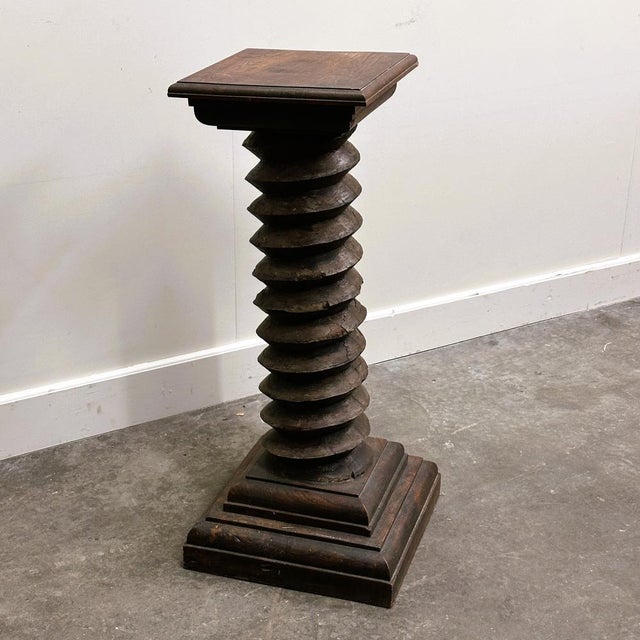 A characterful antique wooden wine pressoir spindle (press screw) masterfully repurposed into a sculptural pedestal...