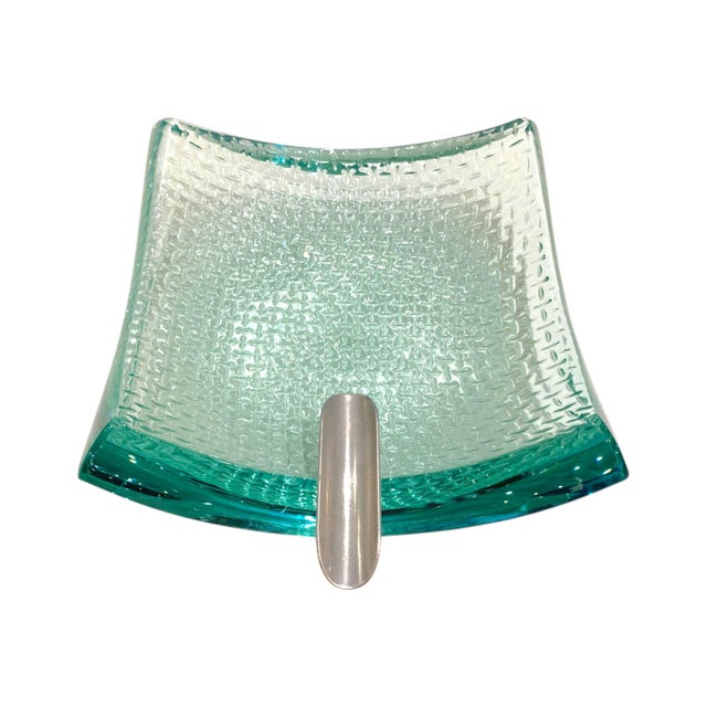 A cigar ashtray created from a thick, heavy piece of glass, making for an impressive statement piece. Striking enough to...