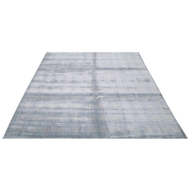 Modern minimalist hand loomed rug with natural colors, contemporary style and soft texture.