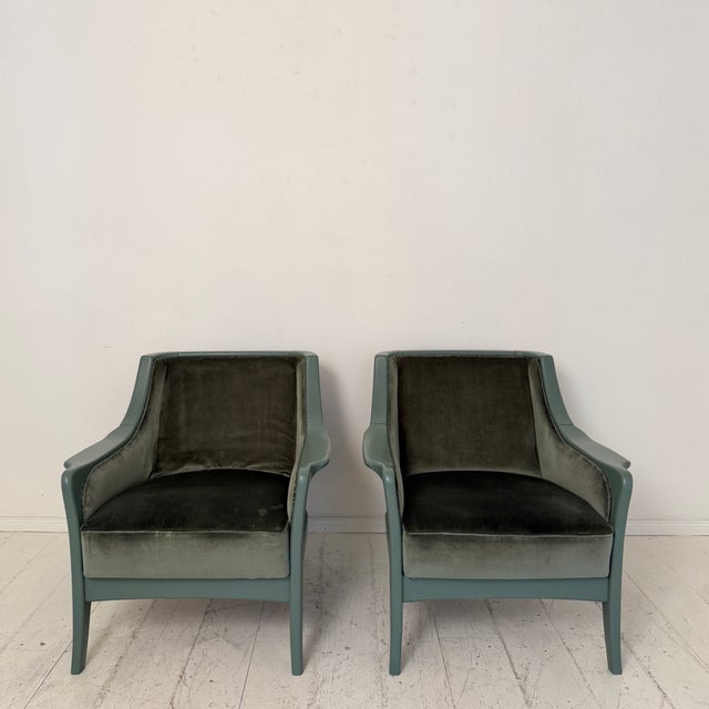 This elegant pair of French lounge chairs was produced during the 1950s and combines refined mid-century design with...