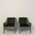 This elegant pair of French lounge chairs was produced during the 1950s and combines refined mid-century design with...