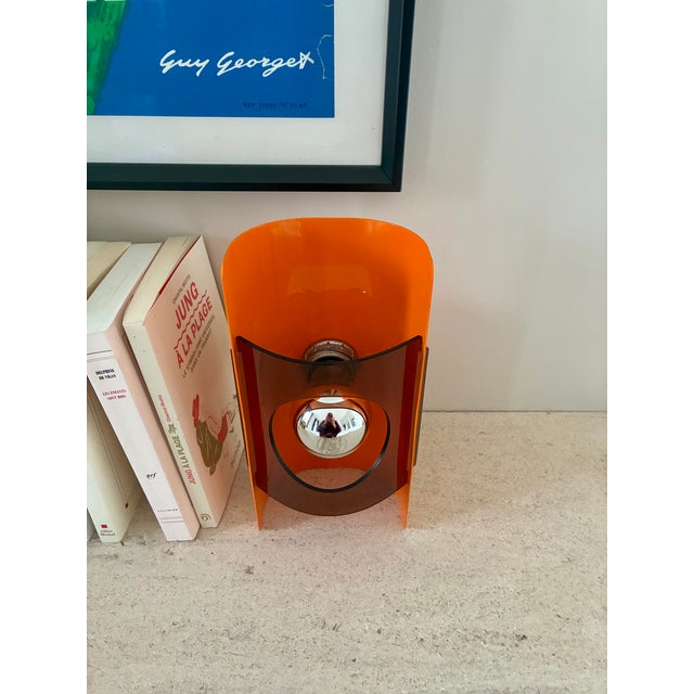 Wall light in orange metal and acrylic glass. In excellent condition – no damage. 1960s/70s. Electrical connection fully...