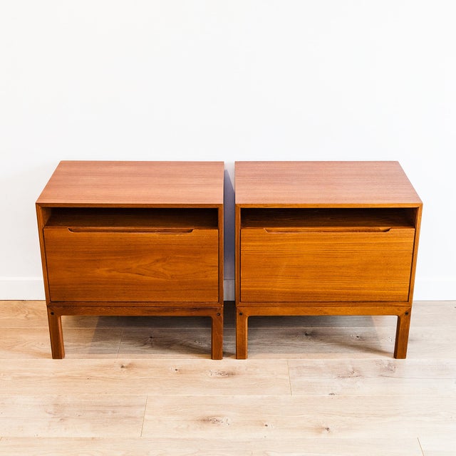 Expertly refinished pair of mid century modern teak nightstands by Arne Wahl Iversen, made in Denmark c. 1970s. Clean...