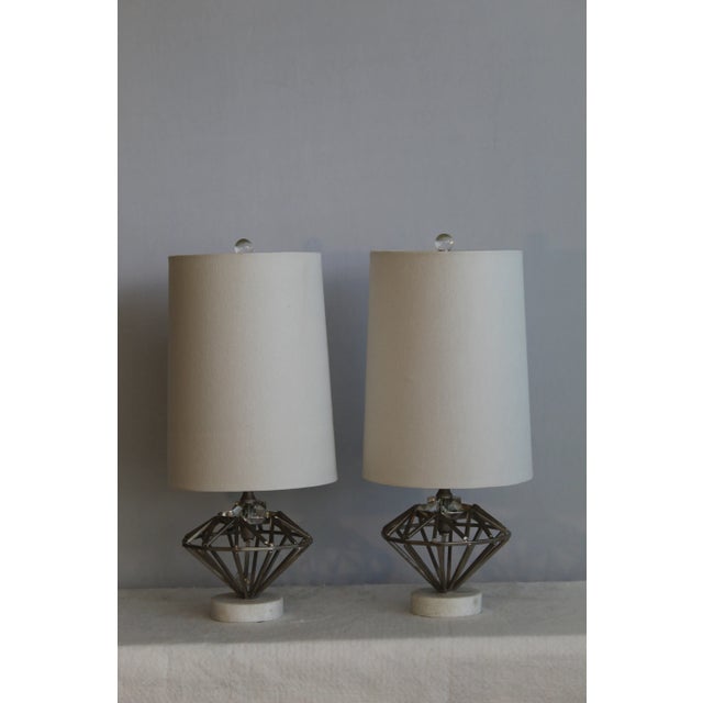 A pair of unique sculptural table lamps. Many pieces on metal welded together to create this petite sculpture. embellished...