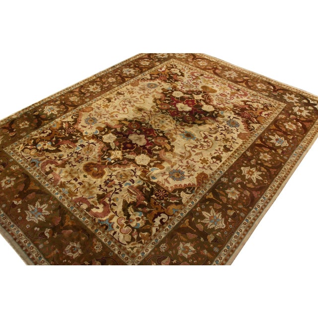 Hand-knotted in wool circa 1910-1920, this antique 10x13 rug is a rare Indian interpretation of Persian Shahrestan rugs—a...