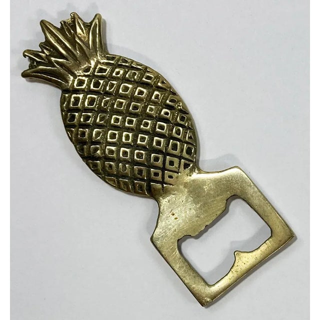 Vintage Hollywood Regency style brass pineapple motif bottle opener. Great detail. Patina.