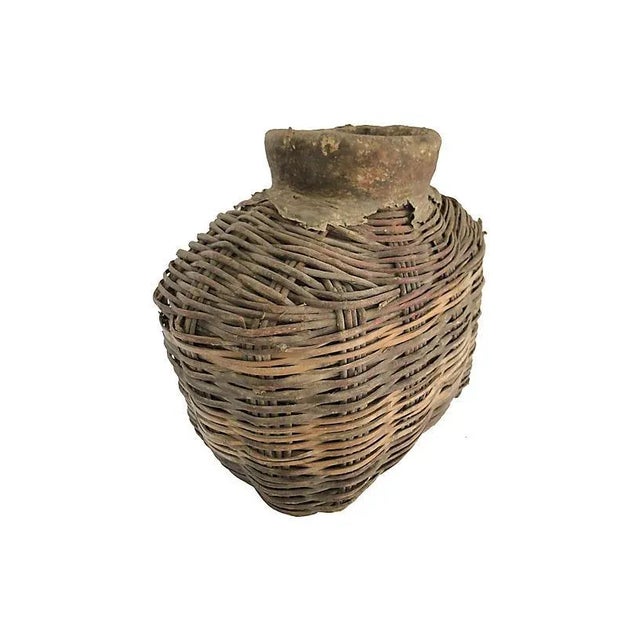 Primitive hand woven rustic fish basket with leather trim from China. looking for a different size??? We've got you...