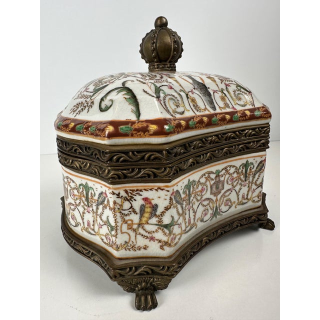 Covered pot made of crackled porcelain with berain painting and exotic birds, gilt bronze frame, handle in the shape of a...